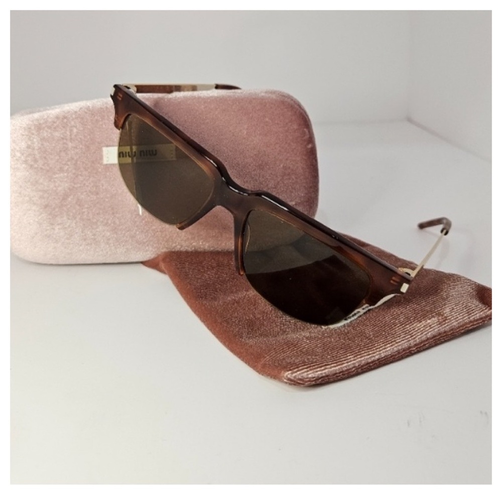 Yves St. Laurent sunglasses and Mui Mui case holder